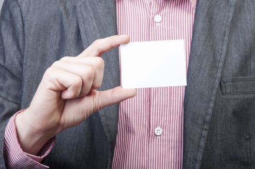 An image of businessmen holding blank card