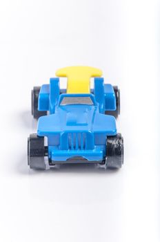 An image of blue toy car isolated on white background