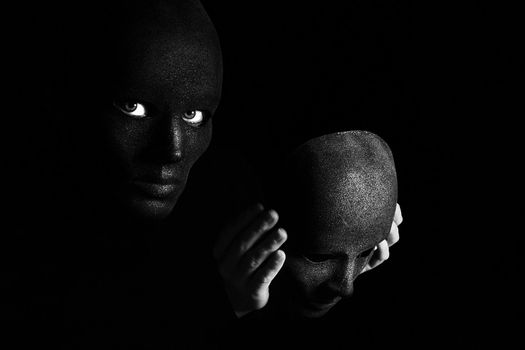 an image of two disguise on a black background