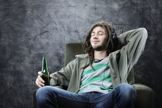 relaxed young man enjoying music 