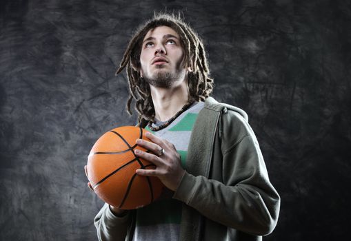 Basketball player taking the shot with a basketball