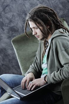 Young man student working with his laptop