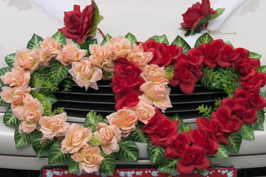 Bridal wreath on a car hood