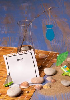 Tear off calendar page and a June still life