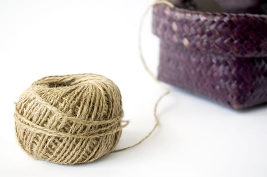 close up ball of hemp rope with basket