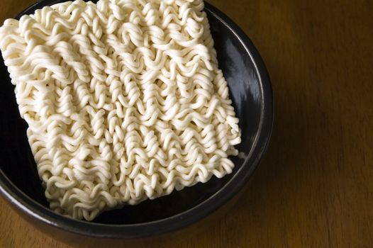 Instant noodle in black bowl