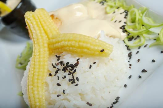 Japanese cuisine .White rice with chunks of vegetables.