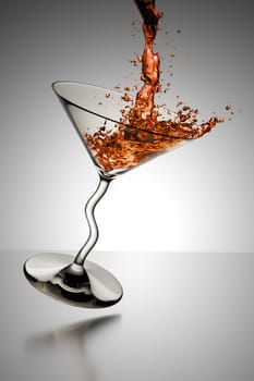 An image of a nice blue cocktail glass splash