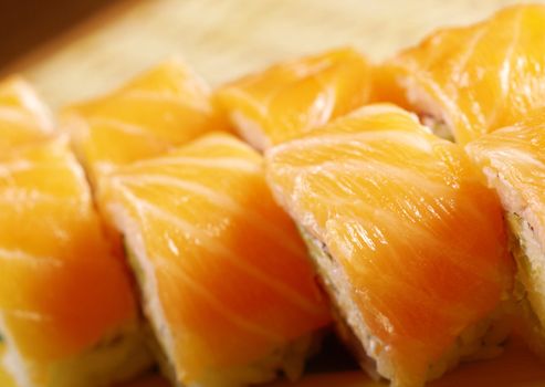 Philadelphia classic. Salmon, Philadelphia cheese, cucumber, avocado, tobiko. Japanese sushi