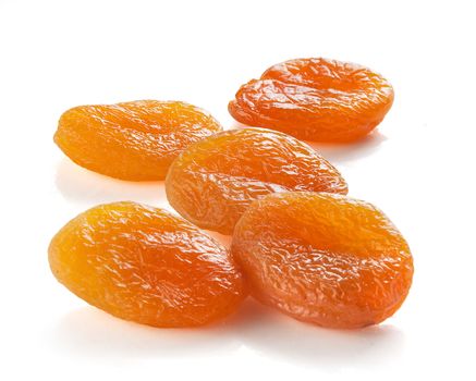 Some dried apricots on the white background