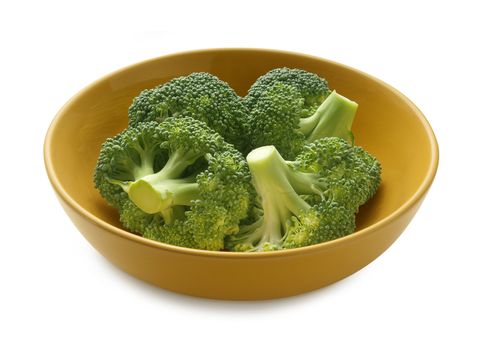 Some pieces of broccoli in the yellow bowl