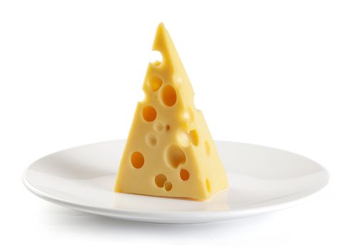 Piece of cheese on the white plate