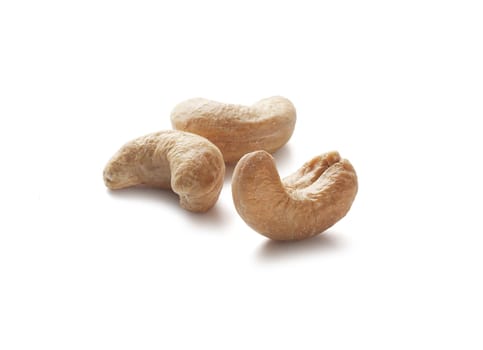Three isolated cashew nut on the white background