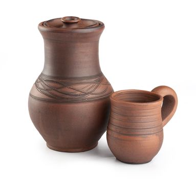 Isolated clay jug and mug on the white background