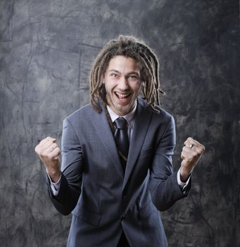 Happy business man celebrates success