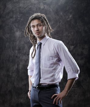 Portrait of positive well-dressed businessman