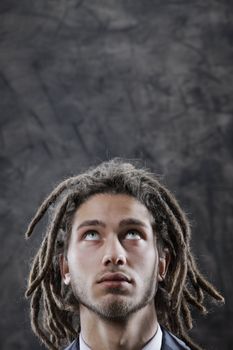 Young man looking up at copy space