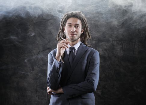 Rastafarian businessman smoking marijuana