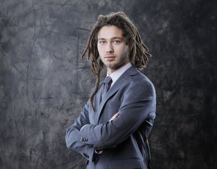 Portrait of a young businessman with arms crossed 