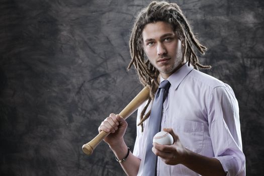 Portrait of young businessman with baseball bat