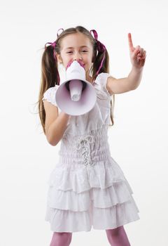 Smiling young little girl with megaphone