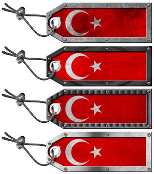 Four grunge metallic tags with Turkish flags, steel cable and metal rivets
