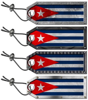 Four grunge metallic tags with Cuban flags, steel cable and metal rivets