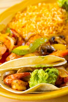 An authentic Mexican food restaurant has plated fajitas ready to serve.