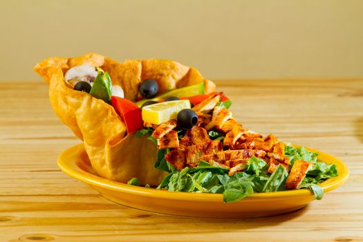 A salad at a Mexican restaurant ready to be served.