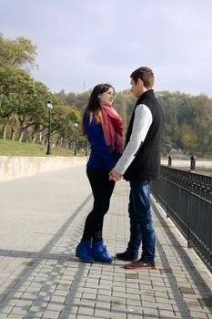 Young couple standing on street