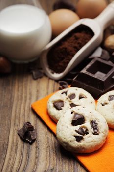 Chocolate chip cookies with ingredients, close up