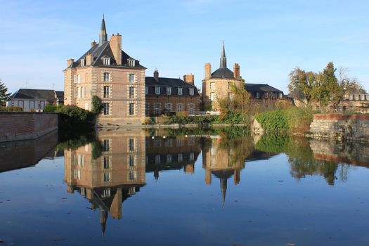a castle with its moats, its park and garden with its towers and its ancient architecture