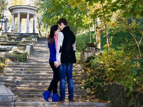 Loving couple in the autumn park abandoned