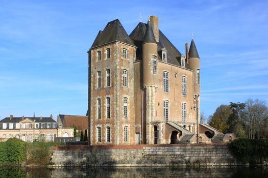 a castle with its moats, its park and garden with its towers and its ancient architecture