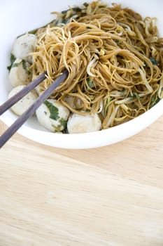 asian noodle bowl with space wooden background for text