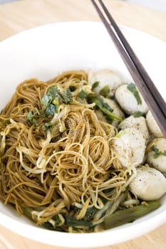 asian noodle in white bowl with chopsticks