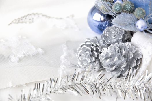 silver pine cones and blue ornament decorations