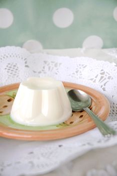 sweet milk pudding on plate with polka dots background