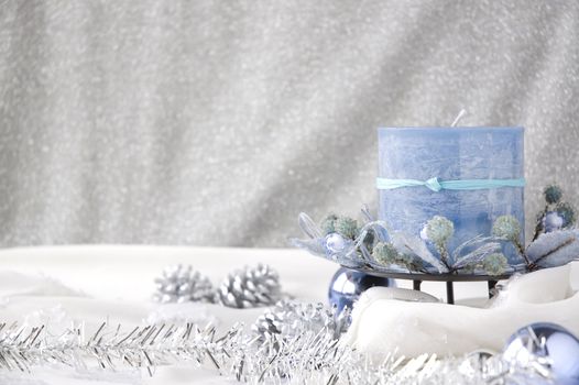 blue candle in winter season