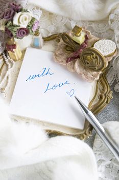 writing with love on note pad in romance style