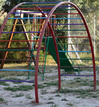 Playground with a circular staircase amid swings and slides