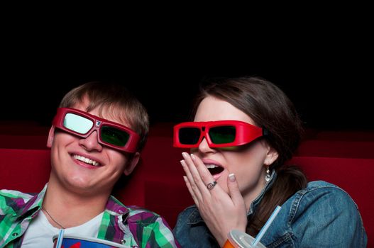 couple in a movie theater, watching a 3D movie