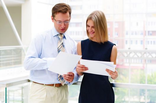 Portrait of young male and female entrepreneurs working together