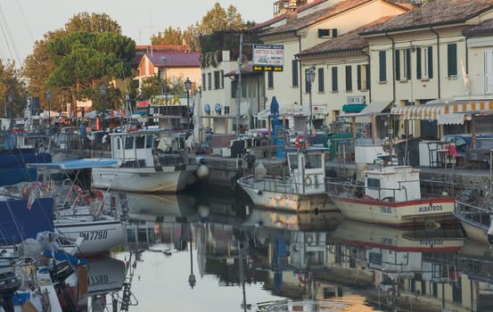 Fishermen's port in the rays of the setting sun. Cervia, Italy.