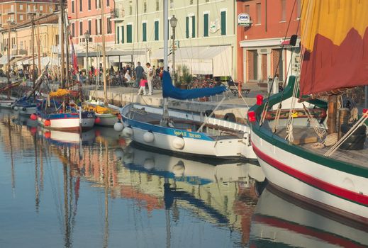 sunset,ship,travel,boat,vacation,sail,water,summer,navigation,sky,romantic,tourism,sailboat,landscape,vessel,yellow,voyage,mediterranean,color,cesenatico,italy,vintage,outdoor,nautical,colorful,blue,italian,reflection,adriatic,church