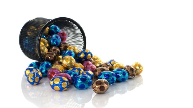 metal container with easter eggs in blue yellow pink and brown