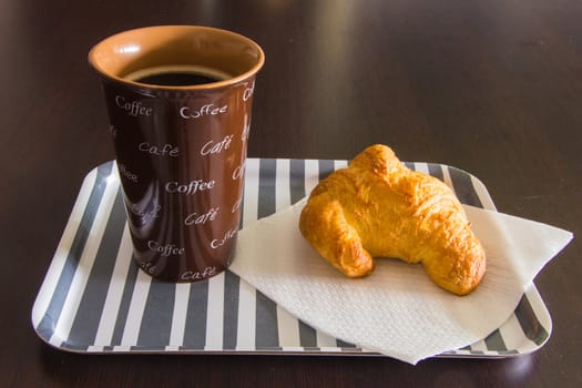 Tray for the morning meal on wooden table