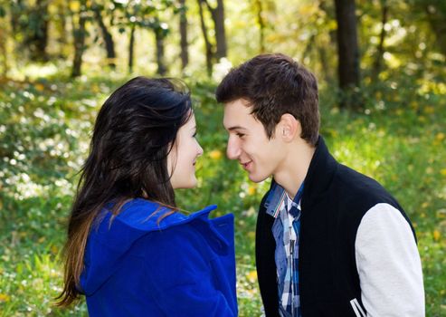 Couple in love talking in the autumn park