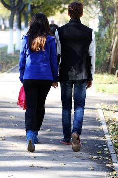 Beautiful loving couple going for a walk outdoors