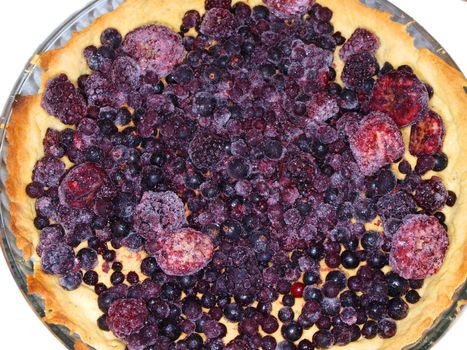 Round pie with frozen assorted dark berries